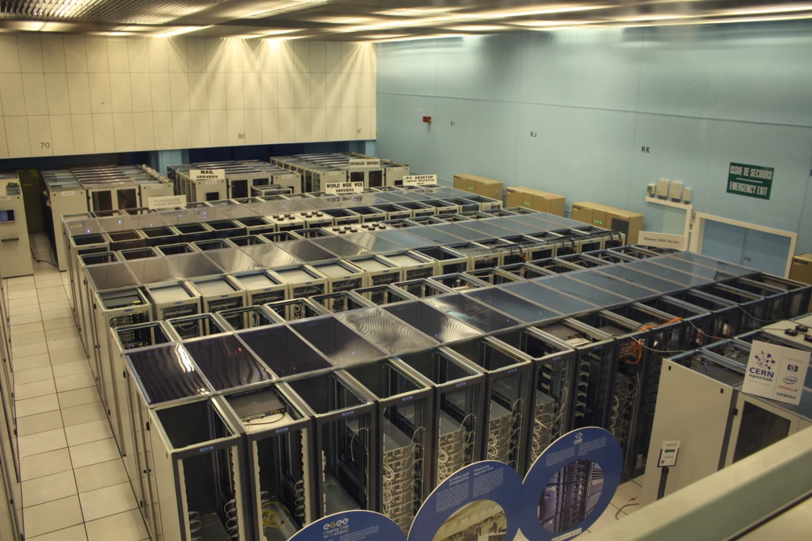 Rows of racks inside a large data center prepared for controlled decommissioning
