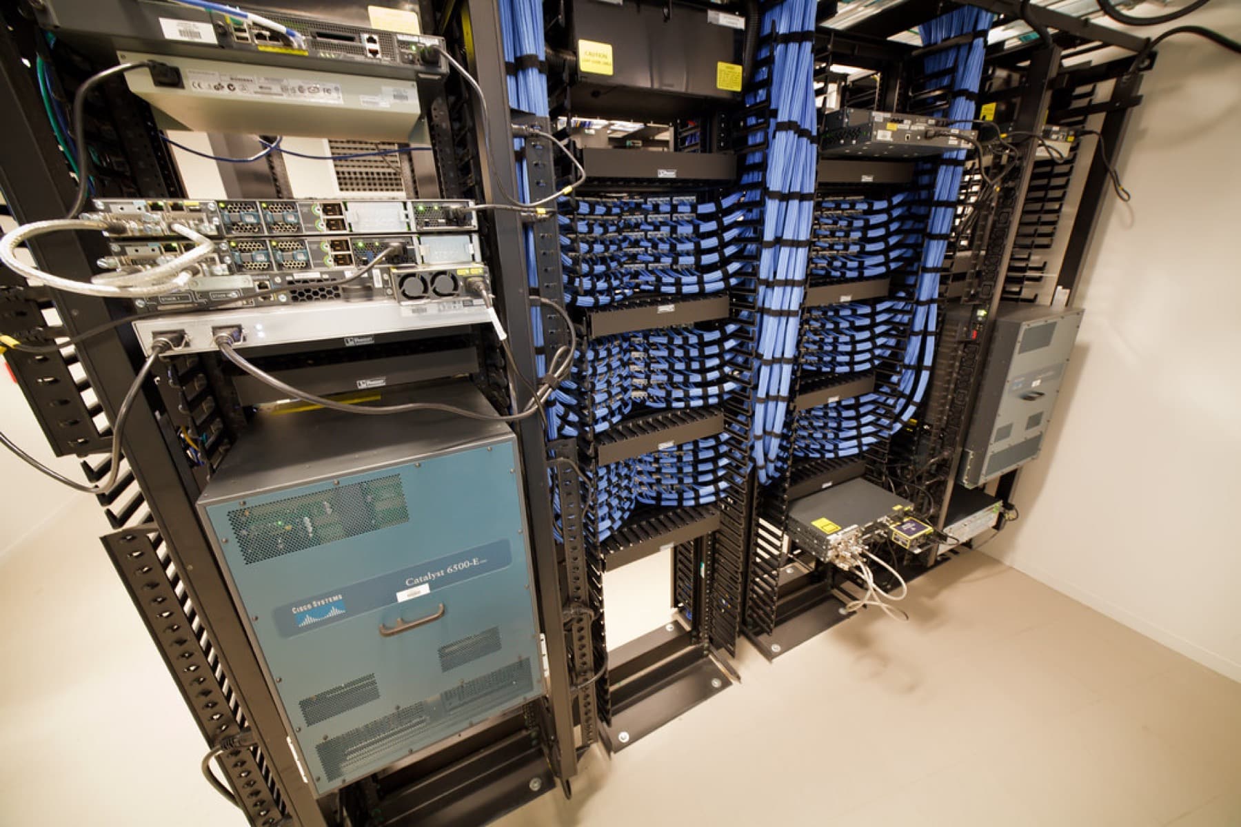 Enterprise network core and rack infrastructure inside a controlled technical environment