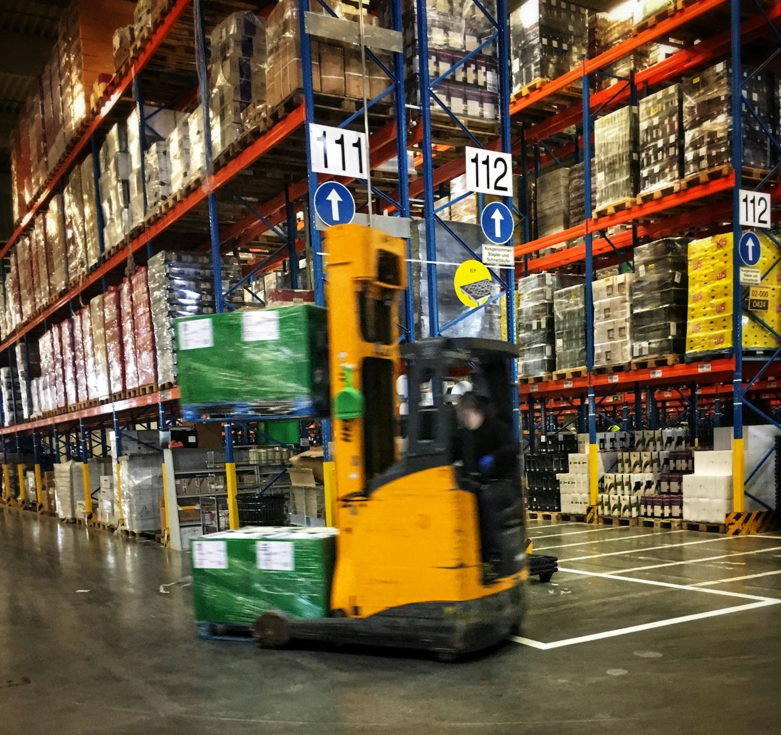 Warehouse aisle with surplus inventory prepared for staged removal